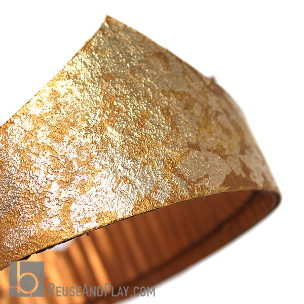 Fitted cardboard crown painted gold with golden flakes
