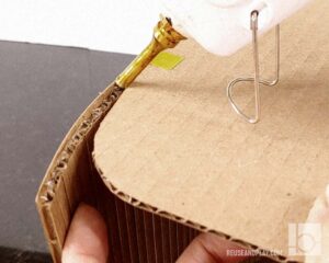 Carefully glue curved tips and secure them with tape