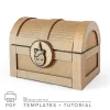Cardboard treasure chest made from corrugated cardboard with unicorn lock decoration and curved pirate-style lid