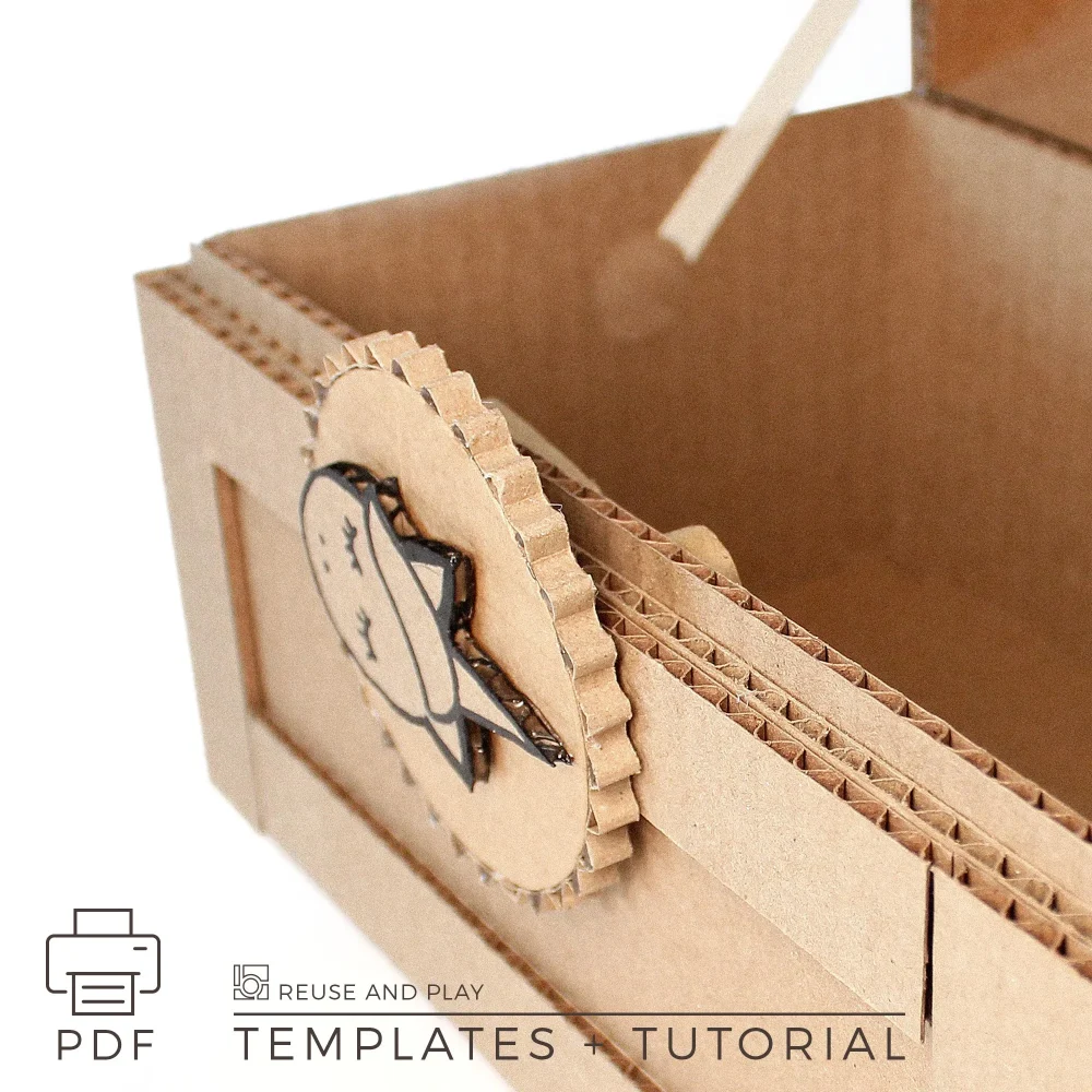 Top angled view of cardboard pirate treasure chest with curved lid and layered cardboard construction